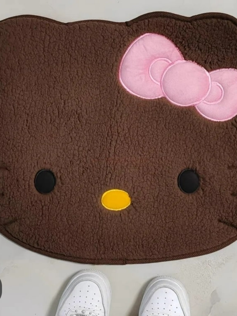 Unk Brown Plush Character Rug with Pink Bow and Yellow Nose